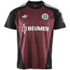 Schalke 04 goalkeeper jersey 2026/27 maroon with black panels and BEUMER wordmark