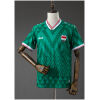 Mens Iraq Away Jersey 2026 front view in green with Mesopotamian pattern and tricolor trim