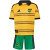 Kids Jamaica Home Kit 2026 youth set front view with gold folk-patterned polo jersey and green shorts
