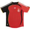 Mens Germany Retro Away Jersey 2006 front view in red with asymmetrical sleeves and DFB crest
