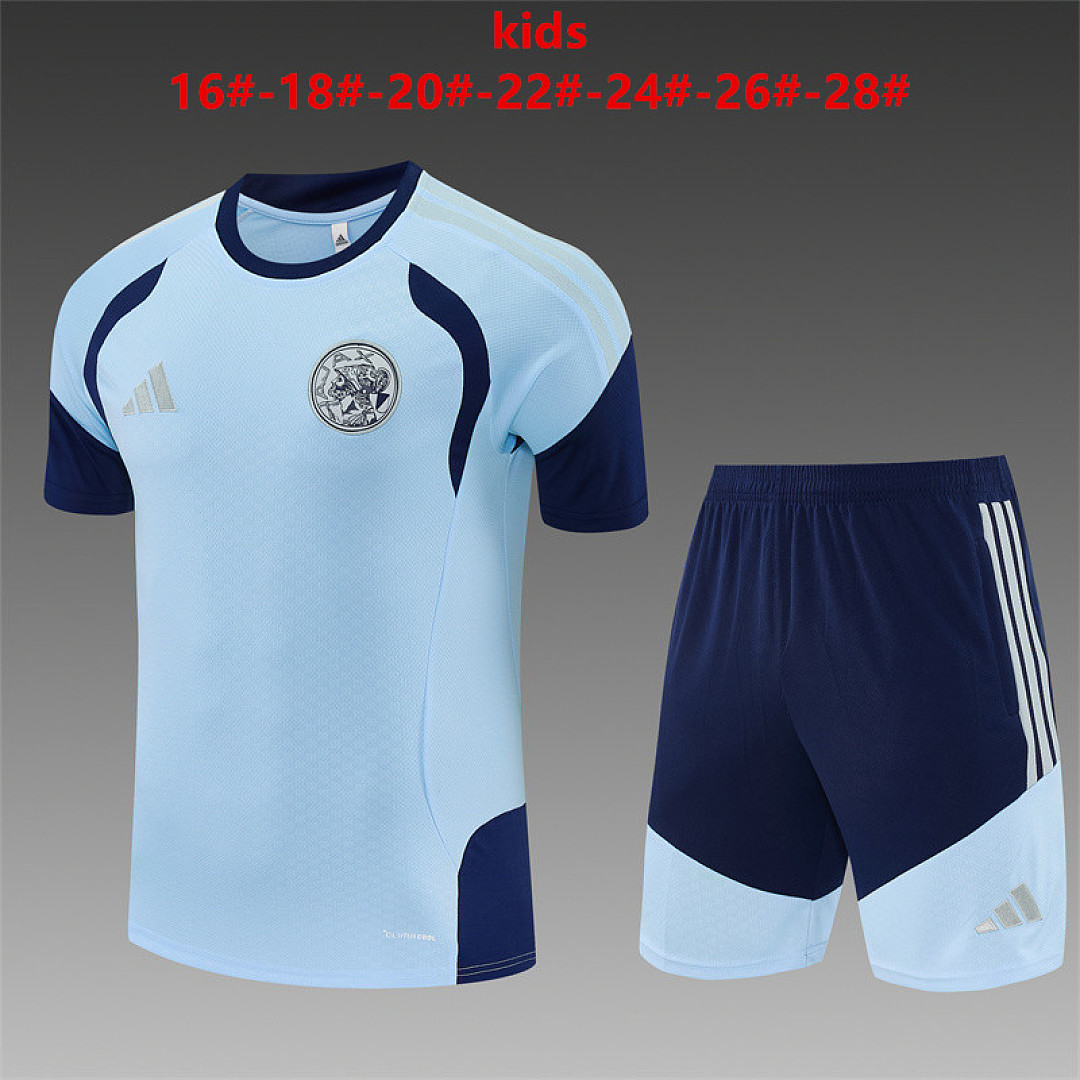 Kids Ajax Light Blue Training Kit 2026/27 Kids Ajax Light Blue Training Kit Kit 2026/27 light blue shirt and navy shorts front view