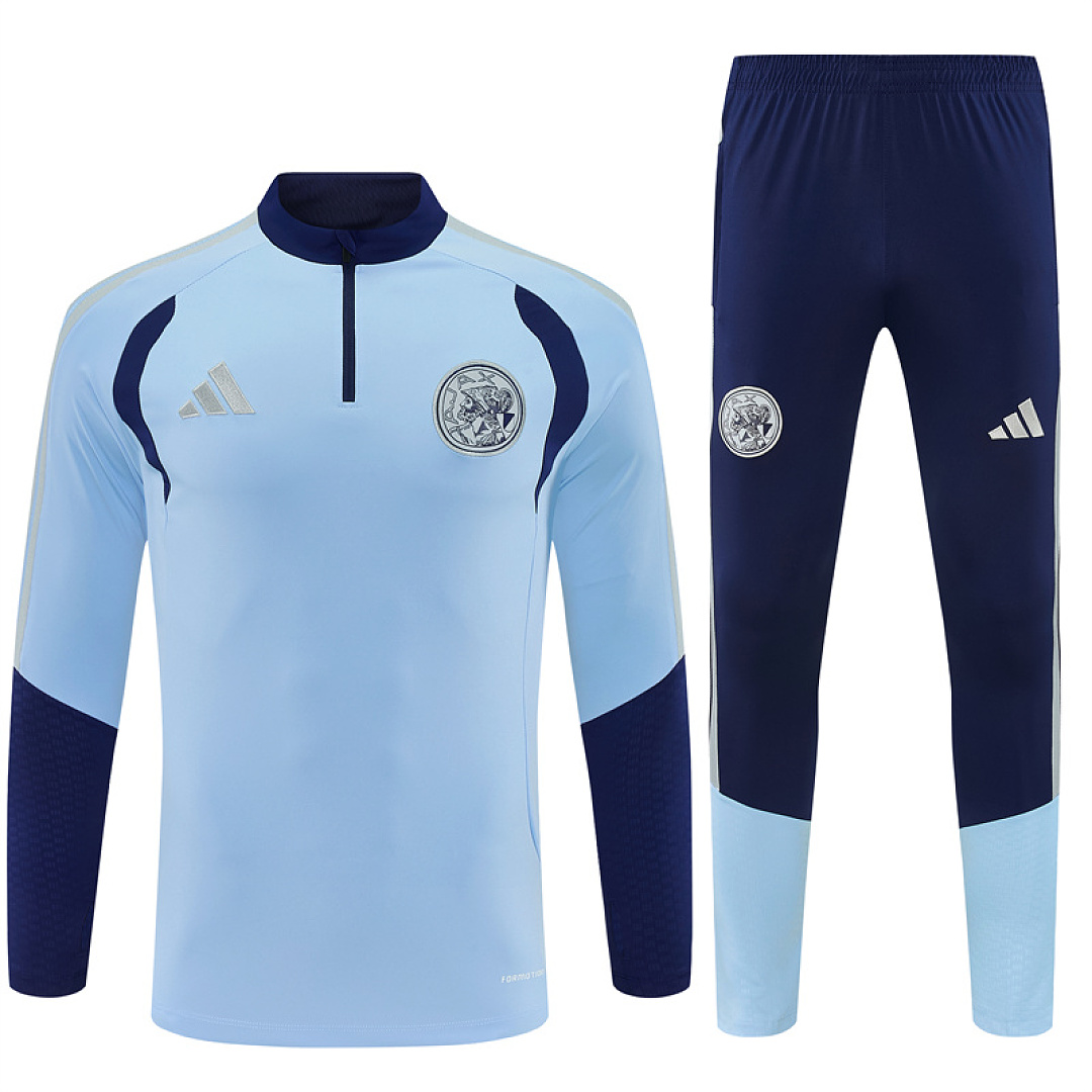 Mens Ajax Half-zip Light Blue Training Kit Suit 2026/27 Mens Ajax Half-zip Light Blue Training Kit Suit 2026/27 light blue top and navy pants front view