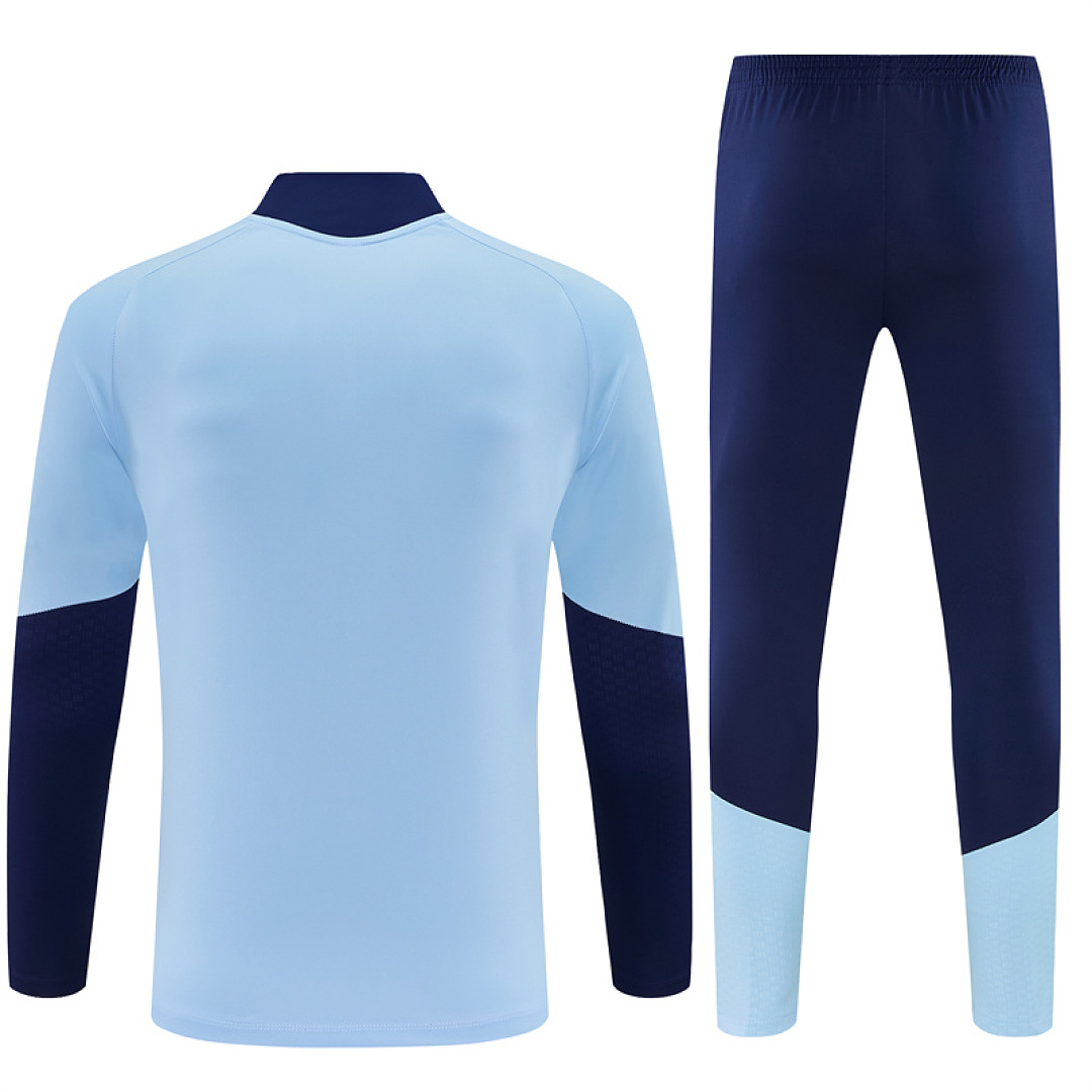Mens Ajax Half-zip Light Blue Training Kit Suit 2026/27 Mens Ajax Half-zip Light Blue Training Kit Suit 2026/27 rear view of shirt and shorts