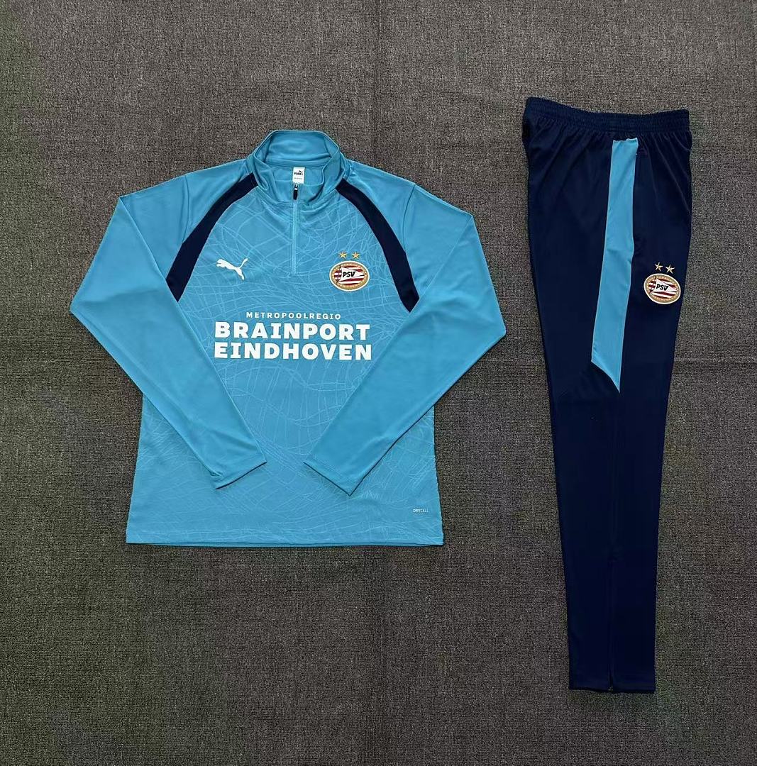 Kids PSV Eindhoven Half-zip Light Blue Training Kit Suit 2026/27 Kids PSV Eindhoven Half-zip Light Blue Training Kit Suit 2026/27 rear view of shirt and shorts