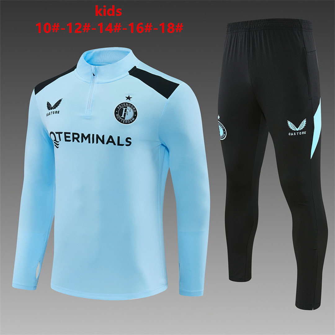Kids Feyenoord Half-zip Light Blue Training Kit Suit 2026/27 Kids Feyenoord Half-zip Light Blue Training Kit Suit 2026/27 light blue top and black pants front view