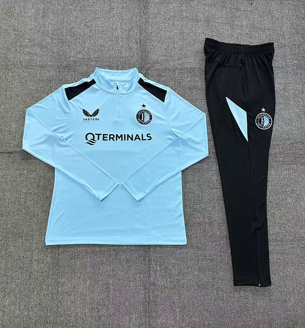 Kids Feyenoord Half-zip Light Blue Training Kit Suit 2026/27 Kids Feyenoord Half-zip Light Blue Training Kit Suit 2026/27 rear view of shirt and shorts